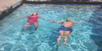 Former president Jacob Zuma swimming with one of his daughters, possibly at his Nkandla homestead, on 31 March 2019. Photo from Twitter/PresJGZuma.