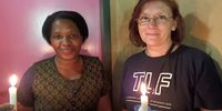 Elizabeth Mashego, manager of the Lerato House, Pretoria, shelter and Wilna de Beer, the CEO of Tshwane Leadership Foundation light candles as part of an event to pray for Lerato house. (Photo: Naledi Sikhakhane)