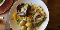 Carpetbag steak  with garlic mash and new potatoes. (Photo: Laurent Bayard)
