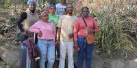 Blessing Nyoni (far left) poses with an inter-racial family in Bhambayi. On the far right are married couple Zizwe Mthunzi and Vanilla Soobramoney. In the back are their children Odel and Kazia. In front is Rochelle Mohanlall, Vanilla’s sister. (Photo: Mlungisi Mbele)