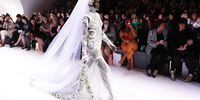  Adut Akech showcases a J'Aton Couture design during the Opening Town Hall Runway at Melbourne Fashion Week at Melbourne Town Hall on August 30, 2019 in Melbourne, Australia. (Photo by Daniel Pockett/Getty Images)