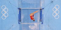 TOKYO, JAPAN - AUGUST 01: Yufei Lu of Team China competes in the Women's Uneven Bars Final on day nine of the Tokyo 2020 Olympic Games at Ariake Gymnastics Centre on August 01, 2021 in Tokyo, Japan. (Photo by Laurence Griffiths/Getty Images)