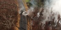 epaselect epa06746139 A handout photo made available by the United States Geological Survey (USGS) on 18 May 2018 shows an aerial view of ground cracks on Pohoiki Road during an overflight of the eruptive fissure area at about 7am Hawaii Standard Time (HST), Hawaii, USA, 17 May 2018. According to the USGS, cracks in the area continued to open and widen, some with horizontal and vertical offsets over the past 24 hours. These cracks are caused by the underlying intrusion of magma into the lower East Rift Zone. An eruption from the Kilauea volcano on 17 May sent ash 30,000 feet (9,144 meters) above sea level in to the sky. An ashfall advisory is in effect for the Ka'u District of Hawaii.  EPA-EFE/USGS / HANDOUT  HANDOUT EDITORIAL USE ONLY/NO SALES
