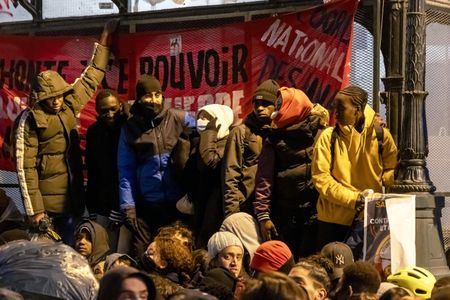 Police evict hundreds of migrants who had been squatting in Paris theatre
