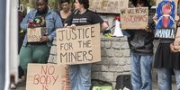 A group of people picket outside the Cape Town International Convention Centre during the Mining Indaba on 5 February 2025 in Cape Town, South Africa. (Photo: Gallo Images / Brenton Geach)