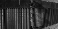 "WPP 10." Migrants using a homemade ladder are helped by a Coyote to climb the wall that separates Mexico from the United States in Ciudad Juárez. Through its policy of denying asylum using the Migrant Protection Protocol and Title 4, the United States has left thousands of people waiting for asylum hearings in dangerous Mexican border cities. Mexico acts as a co-enforcer, militarising its border to detain migrants – building a physical, administrative and psychological barrier shutting out migrants and asylum seekers from all parts of the world. Today, more than ever, the politics of the borders negate the desperate plight of these migrants. They find themselves trapped in a bureaucratic limbo increasingly neglectful of their human rights.</p>
<p>Copyright: © Alejandro Cegarra, Venezuela (Bolivarian Republic of), Shortlist, Professional, Documentary Projects, 2022 Sony World Photography Awards