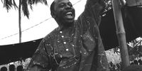 Ken Saro-Wiwa speaking at the Ogoni Day demonstration in 1993 [Tim Lambon/Greenpeace]