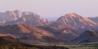 Sunrise in a desert of mountains. Photographer: Gerhard Kroukamp