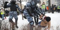 Russian special police units officers detain a protester during a protest in Moscow on 23 January 2021 during a demonstration in support of Alexei Navalny. (Photo: EPA-EFE / Maxim Shipenkov)