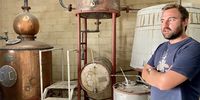 Daniel Nel of Boplaas. On the left is the still his grandfather used, with holes punched in it when KWV controlled the alcohol industry. (Photo: Bianca Coleman) 