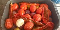 Whole plum tomatoes, red onion, peppers and a head of garlic, roasted, before being turned into peri-peri sauce with plenty of red chilli, white wine and lime juice. (Photo: Tony Jackman)<br>