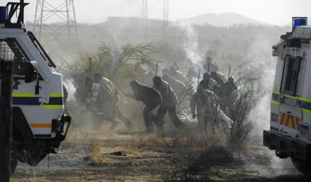 The smell of blood comes back to me as I think of Marikana