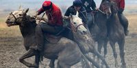 epaselect epa09106599 Kyrgyz horsemen participate in the traditional Central Asian sport of Kok-Boru (goat dragging), a championship of the Chui region in the village of Sokuluk, 30 km from Bishkek, Kyrgyzstan, 30 March 2021. Kok-Boru is a game where players grab a goat carcass from the ground while riding their horses and try to score by placing it in their opponent's goal. Competitions will be held from 30 March to 03 April 2021.  EPA-EFE/IGOR KOVALENKO