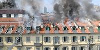 epa09445380 Firefighters work to put out the flames of a vast fire that has developed in an apartment block in the center of Turin, northern Italy, 03 September 2021. A large fire broke out at the top of a Turin apartment block on 03 September, local sources said. The building is situated in the centre of the northwestern city, between via Lagrange and piazza Carlo Felice. The building was evacuated and there were no immediate reports of people being hurt, apart from a women resident who had a bad turn when she saw the smoke. Local shops were also evacuated.  EPA-EFE/ALESSANDRO DI MARCO