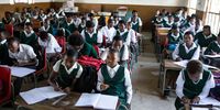 What happened when a South African school switched from English to bilingual science tests