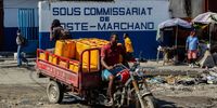 A man carries water cans at Poste Marcharnd in Port-au-Prince, Haiti, 11 March 2025. One year after Ariel Henry announced his resignation as prime minister, Haiti is at a standstill.  EPA-EFE/Mentor David Lorens