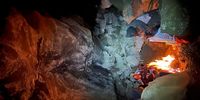 Sharing a cave with Basotho goatherds on a Drakensberg escarpment winter night. Image: Bob Baigrie