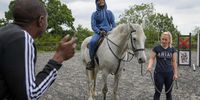 GLASTONBURY, ENGLAND - SEPTEMBER 22: Participants take part in Key4Life’s rehabilitation programme which includes work with horses at the residential retreat centre, on September 22, 2021 in Butleigh near Glastonbury, United Kingdom. The Key4Life charity, started by CEO Eva Hamilton, MBE, works with ex-offenders through their seven-step equine therapy rehabilitation programme to break the cycle of crime, prison, more crime. During the equine therapy sessions  young men complete exercises with horses to help them increase their emotional awareness and unlock pain, build trust and stronger boundaries, move through obstacles holding them back, and support them to take steps towards a positive future. Compared to the national proven re-offending rate of 64% one year post-release those completing the Key4Life rehabilitiaon are only 16% more likely to re-offend. Livvy Adams, Founder of Paintedhorse CIC, who leads the equine therapy sessions, says: “It’s wonderful to witness the change in the men, from when they first see the horses to when they finish the final exercise – they’re standing taller, they're generally smiling, their whole demeanour changes. Many of them have been continuously told they’ll never amount to anything. And today, when we just said - ‘That was really well done’ - you could see the change happening instantly. They know our praise is genuine, and they grow, they expand into a greater version of themselves.”<br>Tomorrow, 23 Sept 2021,  Alderman William Russell, the Lord Mayor of the City of London, hosts the YOUNITED Flag award where the first 15 UK companies to employ ex-offenders will receive recognition from the Key4Life Charity.<br>(Photo by Finnbarr Webster/Getty Images)