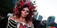 A woman dressed as a catrina participates in the catrina parade in Mexico City, Mexico, 27 October 2024. As part of the traditional celebrations for the Day of the Dead, hundreds of Mexicans and tourists participated and witnessed the Mega Procession of the Catrinas, a parade of skeletons that serves as a prelude to the Day of the Dead on November 1 and 2.  EPA-EFE/Alex Cruz