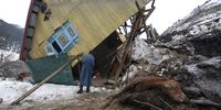 epa10479818 A man inspects a collapsed house following a landslide in the Rezan area of Sonamarg, Ganderbal district, Jammu and Kashmir, India, 20 February 2023. At least 10 houses, several shops and four cowsheds were damaged after a landslide struck the Rezan area overnight. The Srinagar- Leh highway was closed. Other landslides occurred in the Duksar Dalwa area of Ramban with 13 houses damaged.  EPA-EFE/FAROOQ KHAN