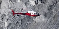 A helicopter flies over the 'Brienzer Rutsch' rockfall danger zone near the village of Brienz-Brinzauls, Switzerland, 15 November 2024. A flow of debris nearly reached the village, which has been evacuated due to the risk of a potential rockslide from the Alpine mountainside above. Now a further 1.2 million cubic meters of rock debris are threatening to slide down.  EPA-EFE/MAYK WENDT
