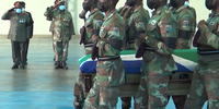 The remains of South African Special Forces Corporal Tebogo Radebe, who was killed in action in Mozambique, arrive at Air Force Base Waterkloof on 23 December 2021 where they were handed over to his family. (Screenshot: Youtube / SA Defence News)