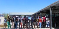Residents of Aussenkehr in a queue at the FNB ATM. Covid19 is not observed. No distance apart and many people wore no mask. (Photo: Brandon van Wyk)
