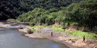 Children are often seen swimming or playing in the Mtakatyi River, traversed by a bridge that leads into Lucingweni village. (Photo: Oupa Nkosi)