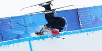 ZHANGJIAKOU, CHINA - FEBRUARY 17: Ben Harrington of Team New Zealand crashes during their second run of the Men's Freestyle Skiing Freeski Halfpipe Qualification on Day 13 of the Beijing 2022 Winter Olympics at Genting Snow Park on February 17, 2022 in Zhangjiakou, China. (Photo by Clive Rose/Getty Images)