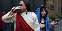 People dressed as Jesus and Mary participate in the Christathon pub crawl on April 9, 2023 in London, England. The Crucifixion-themed pub crawl started at The Trinity pub in Borough and was scheduled to finish at Whitehall's Silver Cross. (Photo by Hollie Adams/Getty Images)