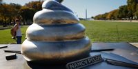 A satirical art installation that "honors" those who participated in the Jan 6, 2021 riot at the U.S. Capitol is seen on the National Mall in on October 24, 2024 in Washington, DC. The temporary art installation depicts an emoji-style poop on top of then-Speaker of the House Nancy Pelosi’s desk. (Photo by Kevin Dietsch/Getty Images)