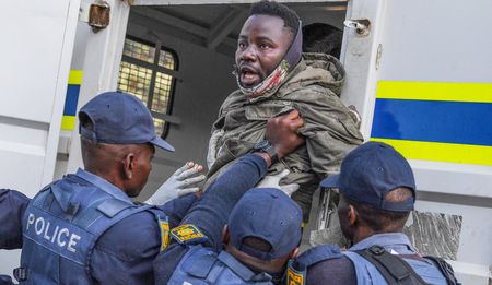 Mothers go one way, children another, during eviction of refugees outside UN offices in Pretoria