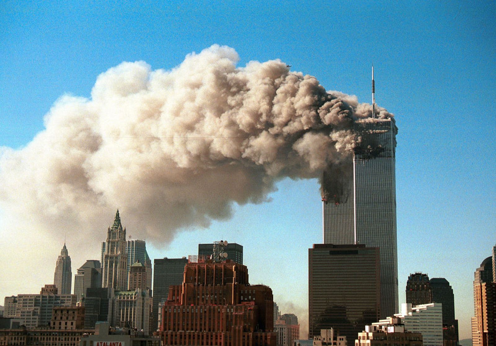 Smoke pours from the twin towers of the World Trade Center after they were hit by two hijacked airliners in a terrorist attack on 11 September 2001 in New York City. (Photo: Robert Giroux / Getty Images)