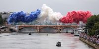 PARIS, FRANCE - JULY 26: Smoke resembling the flag of Team France is shown over Pont d’Austerlitz during the opening ceremony of the Olympic Games Paris 2024 on July 26, 2024 in Paris, France. (Photo by Lars Baron/Getty Images)