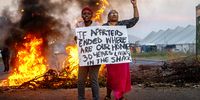 Residents of Gate 7 Informal Settlement protest along Voortrekker Road between Jakes Gerwel Drive and 18th Avenue on May 22, 2024 in Cape Town, South Africa. The group demanded services such as water and sanitation. (Photo by Gallo Images/Die Burger/Jaco Marais)