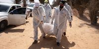Members of the General Authority for Search and Identification of Missing Persons team carry one of the five bodies who was a victim of Al-Kaneyat massacres in newly discovered mass grave, in a large agricultural area known as Mashrou al-Rabet in Meji on September 27, 2021 in Tarhuna, Libya.Tarhuna city was a previous stronghold for Al-Kani militia affiliated with warlord Khalifa Haftar. Since June, following the defeat of Haftars forces in the western areas of Libya, the Libyan government found 193 dead bodies, 96 of them have been identified, in mass graves in Tarhuna and south of Tripoli. (Photo by Nada Harib/Getty Images)