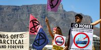 Protestors from Extinction Rebellion picket at the V&amp;A Waterfront where a Russian seismic vessel equipped with airguns is docked. The Akademik Alexander Karpinsky is accused by South African activists of prospecting Antarctica’s Southern Ocean for oil and gas, despite an international mining ban. 29.01.2023. Photo: Shelley Christians