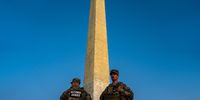 WASHINGTON, DC - SEPTEMBER 2: Members of the National Guard are seen standing near the Washington Monument, on September 02, 2025 in Washington, DC.  Members of the National Guard and Federal Law Enforcement continue to patrol the Nation's Capital, weeks after U.S. President Donald Trump ordered the National Guard and law enforcement to patrol the nation's capital to assist in crime prevention with more than 2,200 National Guard troops have been deployed in Washington, D.C., a mission that experts estimate is costing over $1 million a day when factoring in pay, housing, travel, food, fuel and other logistics, according to comparisons with the 2020 mobilization of 5,000 Guard members that cost more than $2 million daily. (Photo by Kent Nishimura/Getty Images)