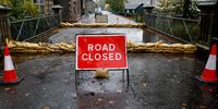  A road closed sign near to the Kingussie Camanachd Club Shinty pitch on October 08, 2023 in Kingussie, Scotland. The Scottish Environment Protection Agency (Sepa) says flooding is expected to affect properties and businesses around the village of Dalfaber (Photo by Jeff J Mitchell/Getty Images)