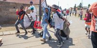 Community members loot from spaza shops in Naledi on October 09, 2024  in Soweto, South Africa.  This comes after five children all friends aged between six and ten, died on Sunday after allegedly consuming chips from a local spaza shop. (Photo by Gallo Images/Sharon Seretlo)