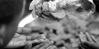 Children receive biscuits from the Groundbreakers community feeding program in Ocean View, Cape Town.  (Photo:  EPA-EFE / NIC BOTHMA)