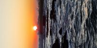 Waves dance at sunrise. Rocky bay. Image: Paul Welch 