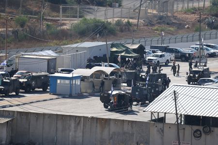 Hamas deploys fighters as hostages released, in show of strength