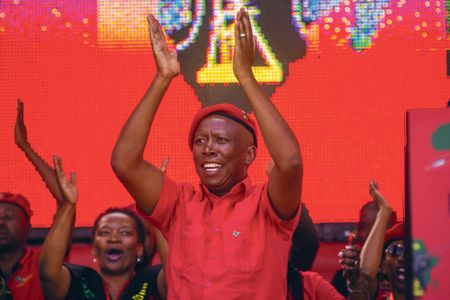 It’s Moulin Rogue! With Juju, an AK-47 and a show tune, the stage is set for a political musical spectacular