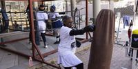 A boxing grannie boxes with a punching bag during the twice weekly boxing grannies training session run by the 'A Team' gym in Cosmo City, Johannesburg, South Africa, 15 August 2024. The boxing grannies is the brain child of former body builder Claude Maphosa aka 'Coach', who started training the grannies in 2013. Many of them come to the training to keep fit and learn how to defend themselves. The ladies train twice a week for an two hours and the youngest grannie is 60 with the oldest being 86 years old. The boxing also helps the elderly with active aging, cardio and cognitive movement.  EPA-EFE/KIM LUDBROOK  ATTENTION: This Image is part of a PHOTO SET