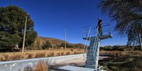Stephen Mullineux, now retired from the Department of Water Affairs, stands on the old diving board at abandoned Teebus. Image: Chris Marais<br>