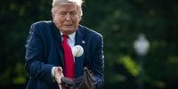 WASHINGTON, DC - JULY 23: U.S. President Donald Trump catches a baseball thrown by former New York Yankees Hall of Fame pitcher Mariano Rivera on the South Lawn of the White House on July 23, 2020 in Washington, DC. President Trump and Rivera met with youth baseball players to celebrate Opening Day of Major League Baseball. (Photo by Drew Angerer/Getty Images)