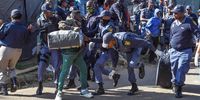 Police arrests some refugees outside  UNHCR offices in Brooklyn on April 21, 2023 in Pretoria, South Africa. It is reported that the refugees do not want to return to their homes in South Africa or to their countries of origin, rather  they want to be sent to a third country due to safety reasons.  (Photo by Gallo Images/Frennie Shivambu)