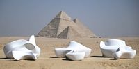 The sculpture titled 'I Love' by Marie Khouri is displayed near the Pyramids of Giza, in Giza, Egypt, 24 October 2024. Forever Is Now, a contemporary art exhibition in its fourth edition organized by Art D'Egypte, showcases the works of 12 international artists using the Pyramids of Giza, a UNESCO world heritage site, and the surrounding plateau as a backdrop from 24 October to 16 November 2024.  EPA-EFE/MOHAMED HOSSAM