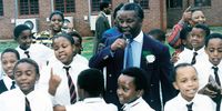 1997. Deputy President Thabo Mbeki dances with school children.